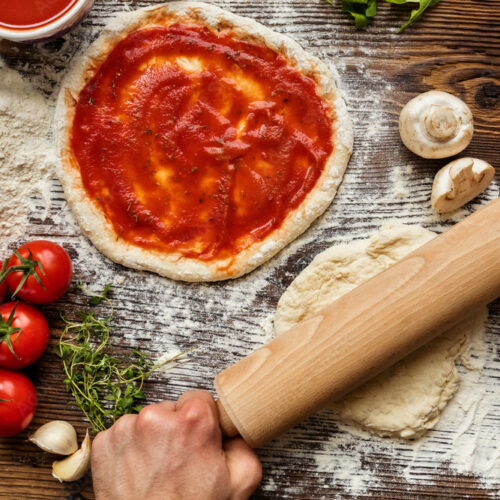 Fresh original Italian raw pizza preparation